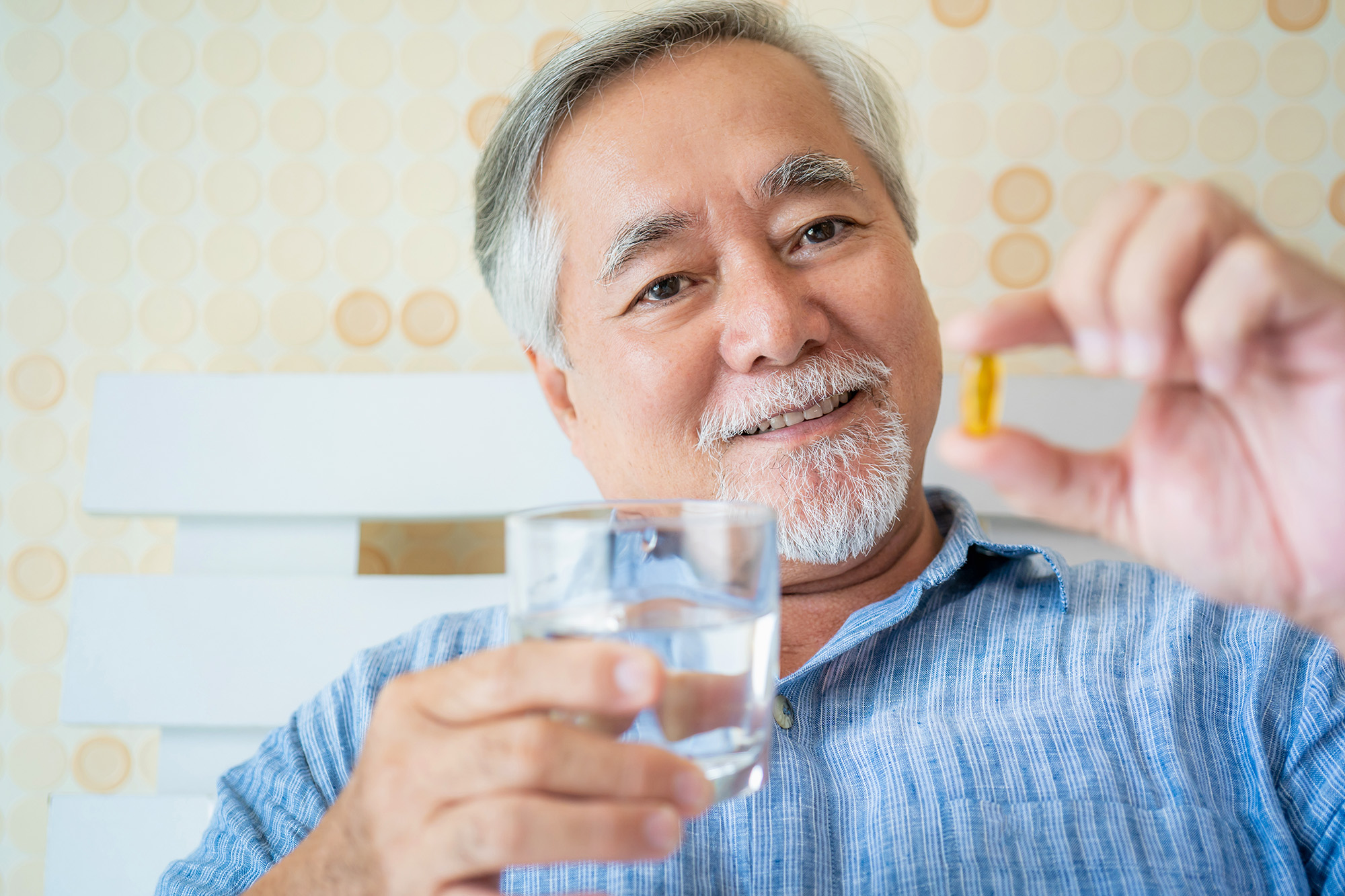 Mature,Man,Healthy,With,Oil,Capsules,Supplement,In,Hands,,old